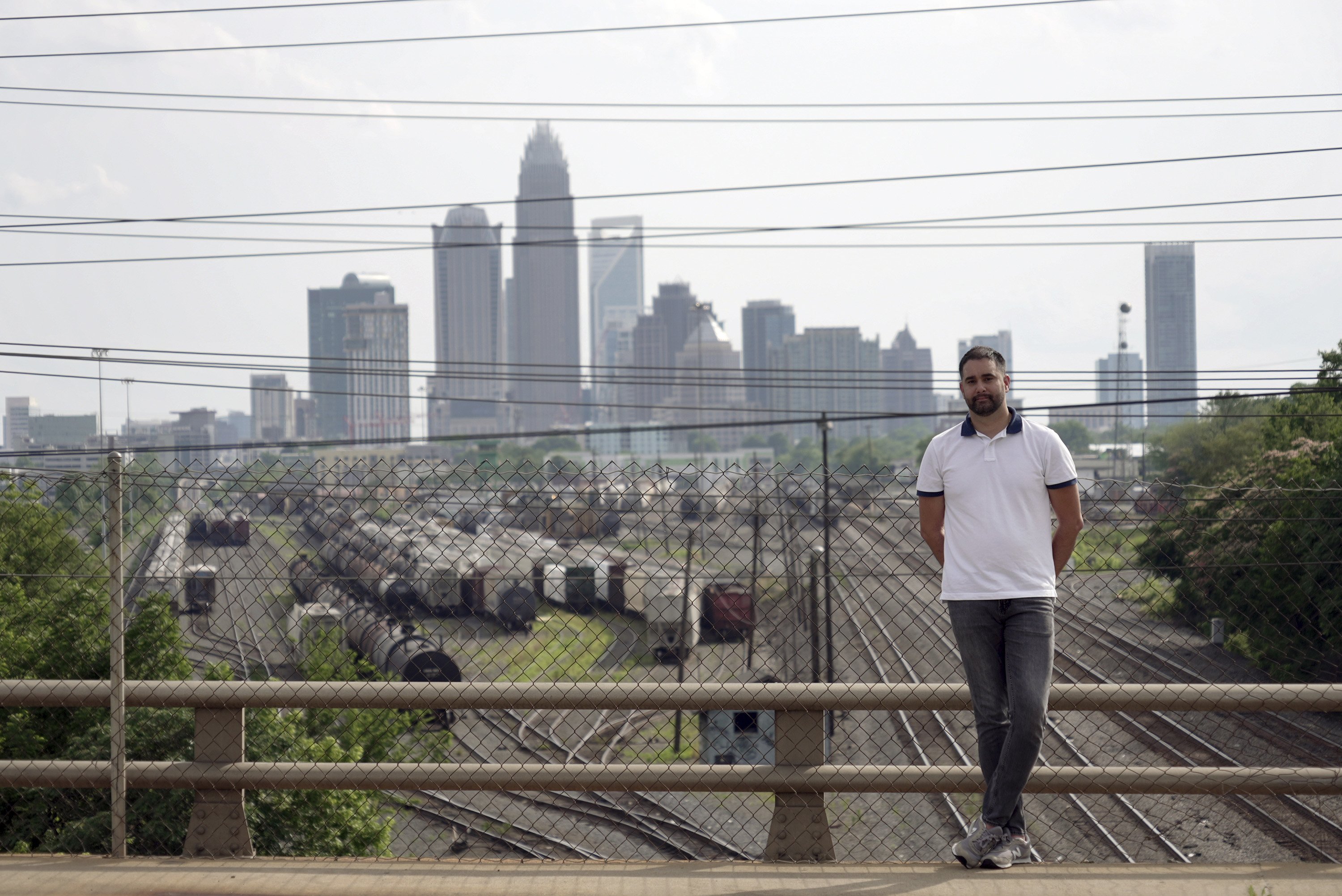 Fernando Hermida stands for a portrait against the skyline of...