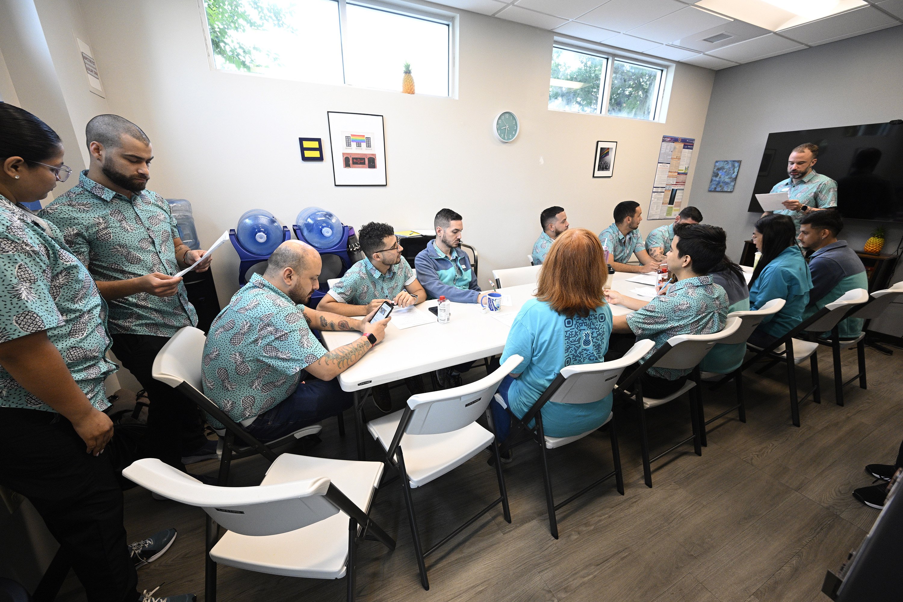 Members of the Pineapple Healthcare medical clinic attend a staff...