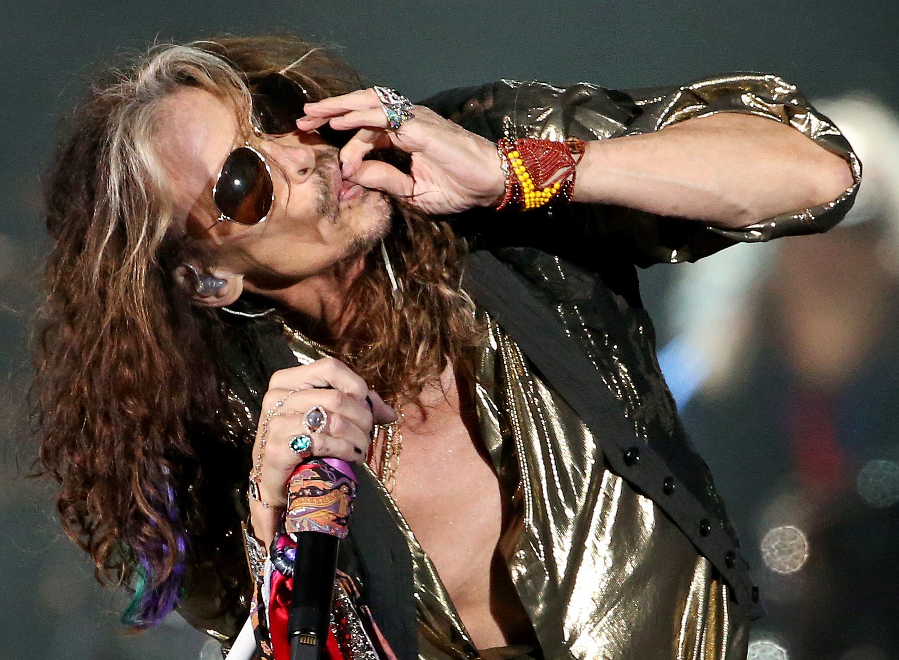 BOSTON, MA – September 8: Steven Tyler of Aerosmith pretends...